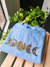 Load image into Gallery viewer, Baby Blue Floral Moon Phase Crewneck
